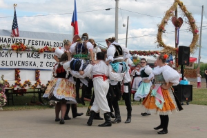 The men carry ladies up in a traditional Czech dance.